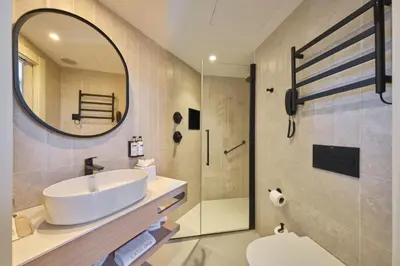 a bathroom with a sink and a shower at Catalonia Park Güell in Barcelona