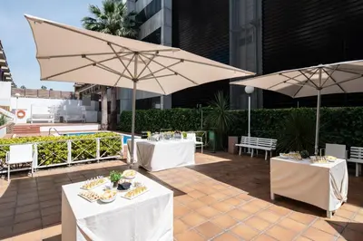 a hotel room with a large bed and a desk at Catalonia Bristol in Sant Andreu de la Barca