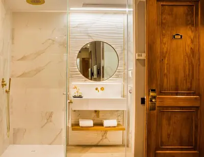 a bathroom with a sink and a mirror at Hotel Nouvel in Barcelona