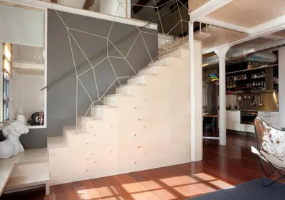a staircase in the living room of a house at Beach Loft Duplex in Barcelona