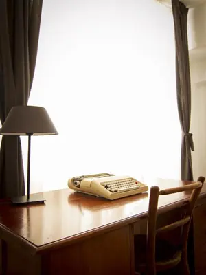 a remote control sitting on a desk with a lamp at Barcelona Just Like Home in Barcelona