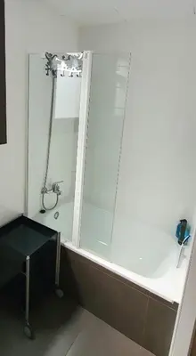 a bathroom with a shower with a glass door at Lovely Appart & Sky View SAGRADA FAMILIA in Barcelona