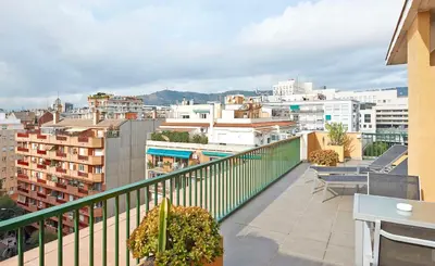 a balcony with a view of a city at NH Barcelona Les Corts in Barcelona