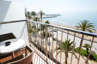 a balcony with a view of the beach at Hotel Subur in Sitges
