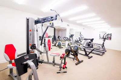 a gym with several treadmills and exercise bikes at Augusta Barcelona Vallès in Granollers