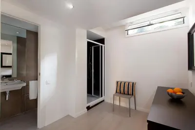 a kitchen with a table and a sink and a window at BarcelonaForRent Urban Town Suites in Barcelona