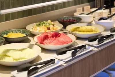 a buffet with bowls of different types of food at Catalonia La Maquinista in Barcelona