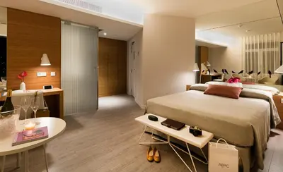 a hotel room with a large bed and a table at Park Hotel in Barcelona