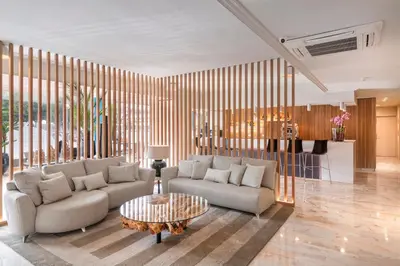 a living room with a couch and a table at Salles Ciutat del Prat Barcelona Airport in El Prat de Llobregat