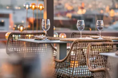 a table with wine glasses sitting on top of it at Sallés Hotel Pere IV in Barcelona