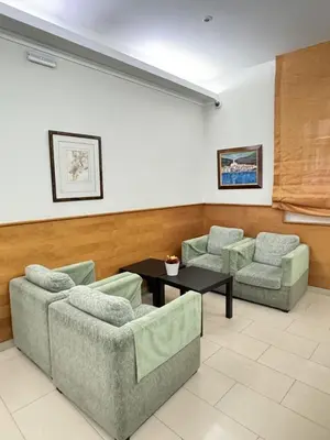 a waiting room with two couches and a table at Catalunya in Barcelona