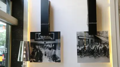 two black and white photographs on the side of a building at Evenia Rocafort in Barcelona