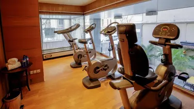 a row of exercise bikes in a gym at Evenia Rossello in Barcelona