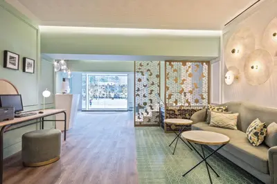a living room with a couch and a table at Hotel Via Augusta in Barcelona