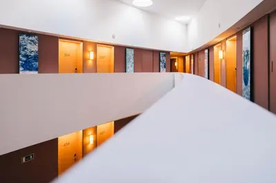 a hallway with a row of lockers in a building at El Sant Cugat, 4 estrellas superior in Sant Cugat del Vallès