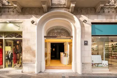 a store front with an archway in a building at BYPILLOW Mothern in Barcelona