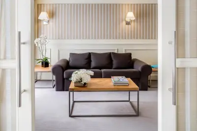a living room with a couch and a coffee table at Majestic Hotel & Spa Barcelona GL in Barcelona
