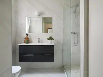 a bathroom with a sink and a glass shower at Casa Cosi El Farro 4 in Barcelona