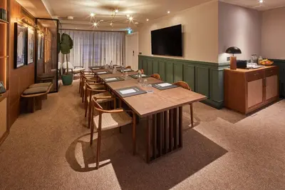 a conference room with a long table and chairs at Via Sants Hotel Barcelona, Tapestry Collection By Hilton in Barcelona