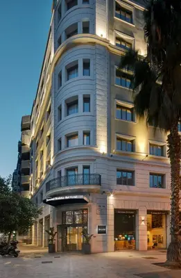 a tall white building with a balcony in front of it at Sercotel Amister Art Hotel Barcelona in Barcelona