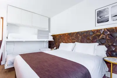 a bedroom with a large white bed in a room at Best Western Plus Hotel Alfa Aeropuerto in Barcelona