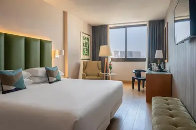a hotel room with a large white bed and a window at Hesperia Barcelona Sant Just in Sant Just Desvern