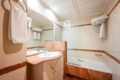 a bathroom with a sink and a bath tub at Apartaments Marina - Abapart in Barcelona