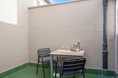 a table and chairs sitting on a patio at Hotel Lleó in Barcelona
