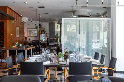 a dining room with a table and chairs at Abba Sants in Barcelona