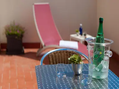 a bottle of wine and two glasses on a table at Hotel Sagrada Familia in Barcelona