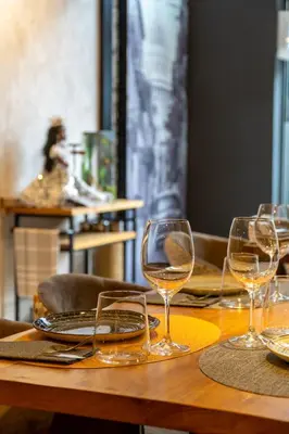 a wooden table with wine glasses on it at Sunotel Aston in Barcelona