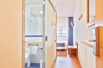 a bathroom with a sink and a mirror at Acta Antibes in Barcelona