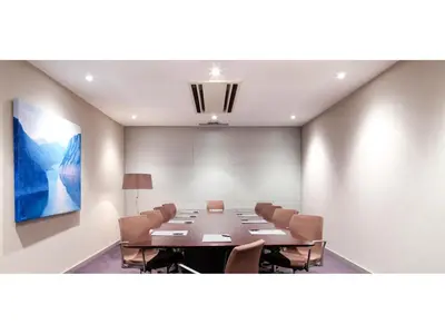 a conference room with a long table and chairs at Hotel Ciutat Martorell in Martorell
