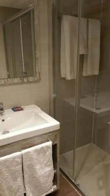 a bathroom with a sink and a shower at La Ciudadela in Barcelona