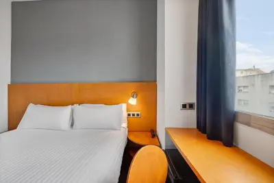 a hotel room with a bed and a window at B&B HOTEL Barcelona Mollet Porta de Gallecs in Mollet del Vallès