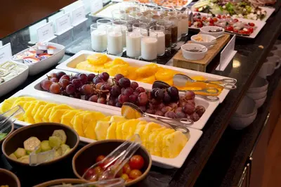a buffet with many different types of fruits and snacks at Best Western Premier Hotel Dante in Barcelona