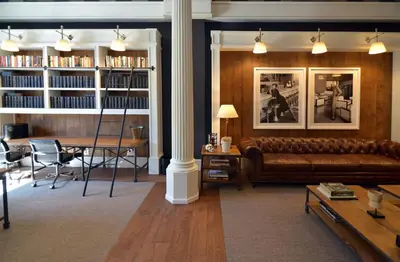 a living room with a couch and a table at Hotel Granvia in Barcelona