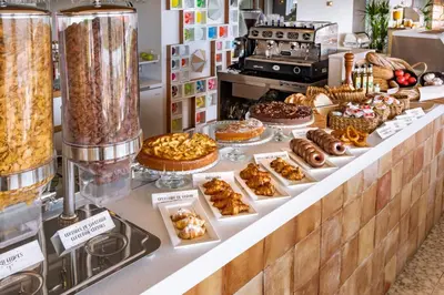 a bakery counter with various pastries and other desserts at Bel Air in Castelldefels