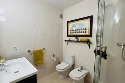 a bathroom with a toilet and a sink and a shower at Mediterranean house, beach and charm garden in Arenys de Mar