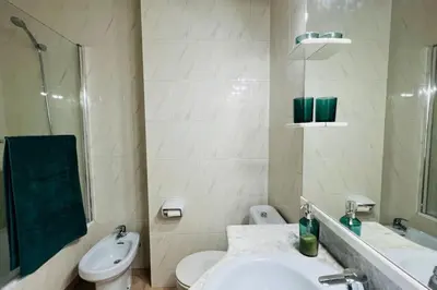 a bathroom with a sink and a toilet and a shower at Mediterranean house, beach and charm garden in Arenys de Mar