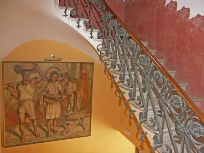 a painting on the side of a stairway at Hotel Celimar in Sitges