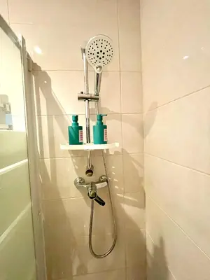 a bathroom with a shower with a shower head at Pensión Bertolín in Barcelona