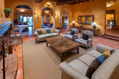 a living room with couches and a table at Gran Hotel Rey Don Jaime in Castelldefels