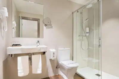 a bathroom with a toilet and a sink and a shower at Hotel Acta Azul Barcelona in Barcelona