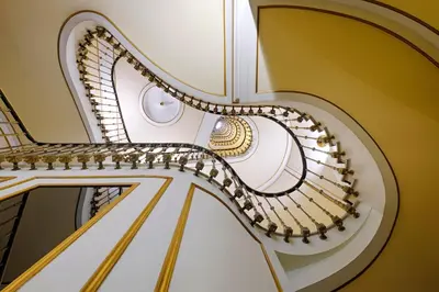 an image of a spiral staircase in a building at El Avenida Palace in Barcelona