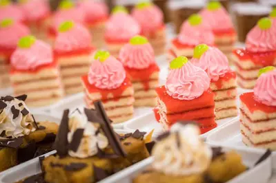 a bunch of desserts in styrofoam trays at htop Olympic #htopEnjoy in Calella