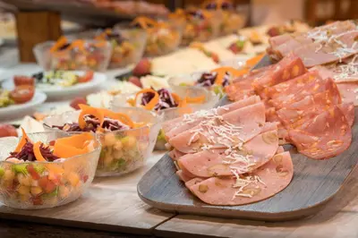 a table with many different types of food on it at htop Pineda Palace 4Sup - Adults Only #htopBliss in Pineda de Mar