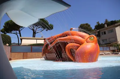 a large orange inflatable rubber duck in a pool at htop Jadhe 4Sup #htopBliss in Calella