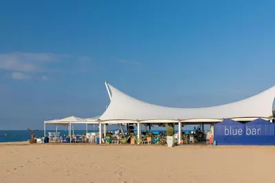 a large tent on the beach with a blue sky at htop Amaika & SPA 4Sup - Adults Only #htopBliss in Calella