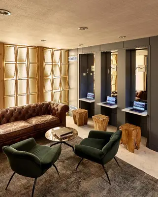 a living room with a couch and chairs and tables at Hotel Barcelona Catedral 4 Sup in Barcelona